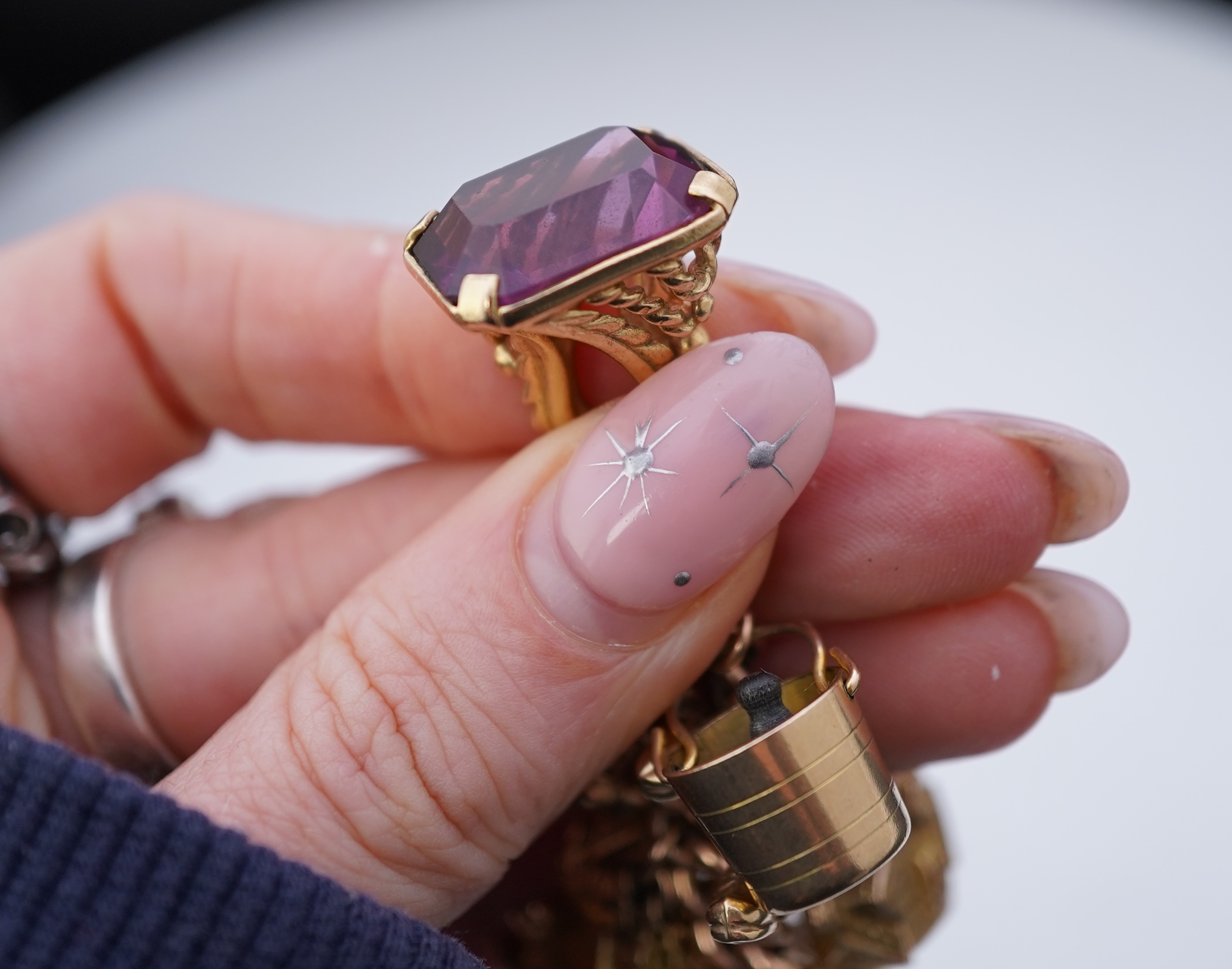 A 9ct gold charm bracelet, mid 20th century